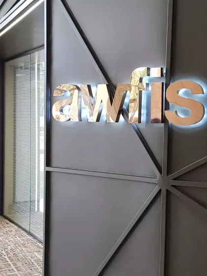 The backlit logo detail on the Awfis pod highlights the premium finish. My automation systems are designed to complement and enhance the interior design of any commercial space.