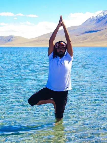Performing Vrikshasana (Tree Pose) in the pristine waters of a Himalayan lake. This is what it feels like to be truly balanced and one with the elements.