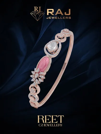 A delicate and feminine bracelet featuring soft pink and white stones in an elegant, flowing design. This piece is perfect for adding a touch of romantic color to your wrist.