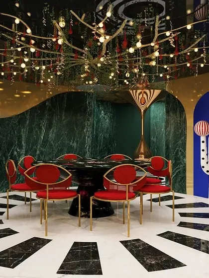 We believe design should also be fun. This dramatic dining space from our "Whimsy Wonder" project showcases our love for maximalism, with a theatrical chandelier, bold colors, and quirky art creating an unforgettable, immersive experience.