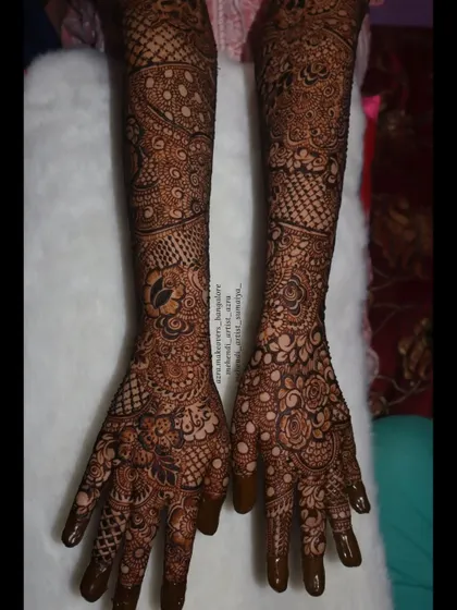 This full arm design shows a mix of different patterns, from floral to geometric, creating a unique and personalized bridal mehendi.