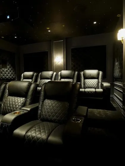 A close-up on the premium, diamond-stitched black leather recliners. These seats not only look luxurious but also provide exceptional comfort and support.