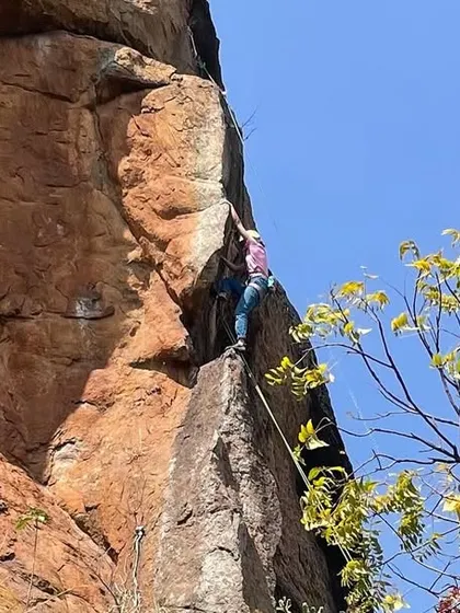 A climber on a beautiful, exposed arête at Talai Betta. The climbing here is as aesthetic as it is challenging.