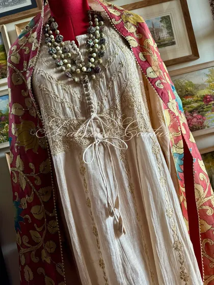 A full-length view that captures the majestic presence of this handcrafted Anarkali ensemble, a true heirloom piece.