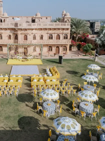 An aerial view of the magnificent yellow-themed Haldi ceremony we organized in the lawns of a heritage palace in Rajasthan.