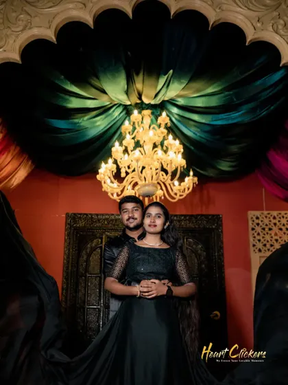 A dramatic pre-wedding portrait with rich colors and elegant lighting. This shot has a luxurious and theatrical feel.