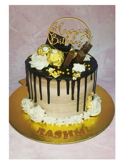 Back to basics with this chocolate overloaded Ferrero Rocher cake. The rich chocolate drip and golden chocolates make it an indulgent treat.