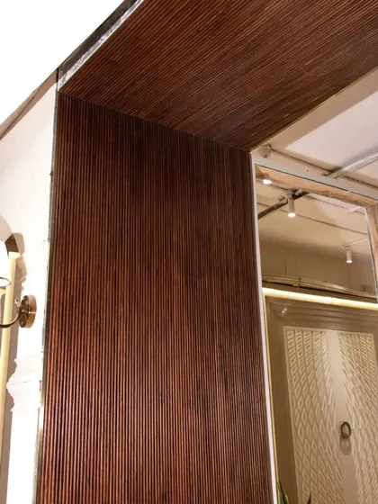 Another example of the deep texture veneer, this time used to wrap around a corner. The fluted pattern catches the light and adds a sense of drama.