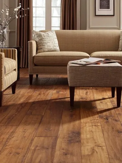 Here is a medium-toned wood floor that brings warmth and comfort to a traditional living room setup. This durable flooring option is ideal for family spaces that see a lot of activity.