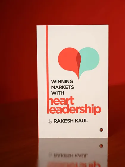 A clean, simple shot of the book against a bold red background. This makes the cover design stand out and is great for promotional graphics.