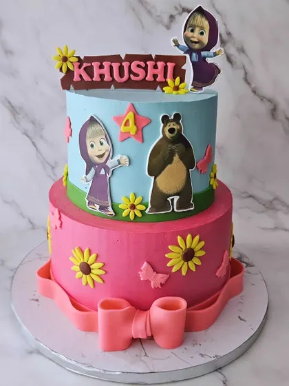 Khushi's 4th birthday with Masha and the Bear. This two-tier cake features the mischievous Masha and her friendly bear, set against a fun, floral background.
