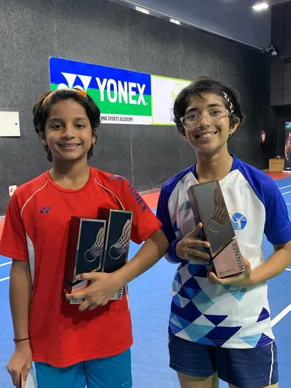 Nandini (right) with her winner's trophy alongside the runner-up. Healthy competition pushes all my athletes to be better.