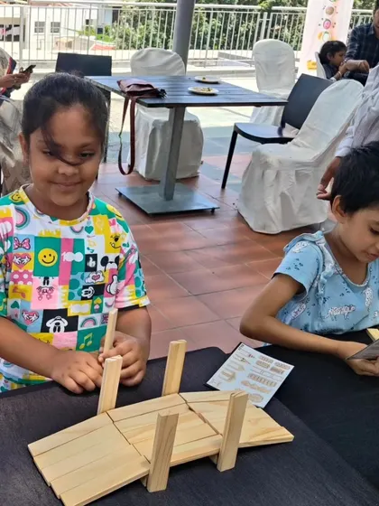 It's pure joy to see children so engrossed, building bridges between mindsets and communities. They quickly identify patterns and use their innate curiosity to construct amazing things, turning simple planks into expressions of their imagination.