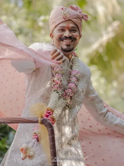 Another shot of the groom's dynamic entry, full of style and smiles.