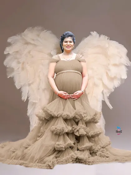 Another take on the angel wings theme, this time with large, feathery wings for a soft and ethereal look.