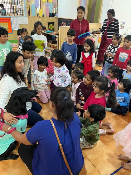 The children are completely engaged and fascinated by their furry visitor. These special events create a dynamic and exciting learning environment.