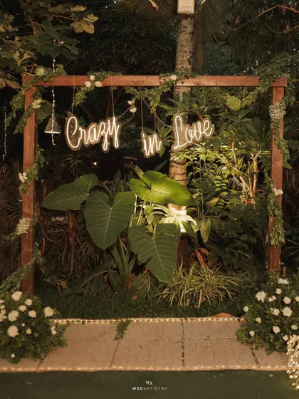 A close-up of the "Crazy in Love" neon sign. This detail shot shows how you can personalize our space with unique decor elements for your event.