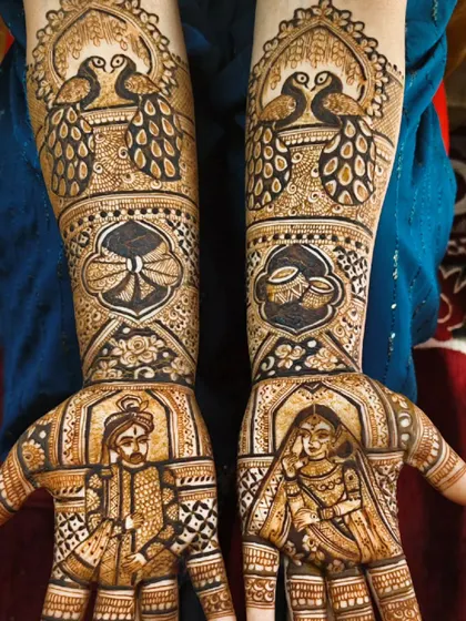 A royal union adorned in intricate mehndi. This design features a classic Raja and Rani portrait, complete with peacocks and other regal elements.