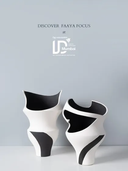 The fluid, calligraphic shapes of these black and white vases make them appear as if they are in motion. They are designed as a pair, creating a dynamic dialogue of form and negative space.