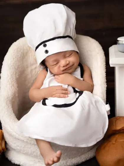 A happy, sleepy smile from our little chef. Even in their sleep, their personalities can shine through in these themed photoshoots.