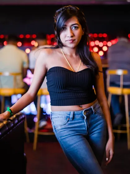 A guest posing at the bar.