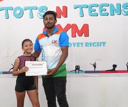A proud moment for one of our gymnasts receiving her Level 1 certification from her coach. These milestones are so important for building confidence and recognizing progress.