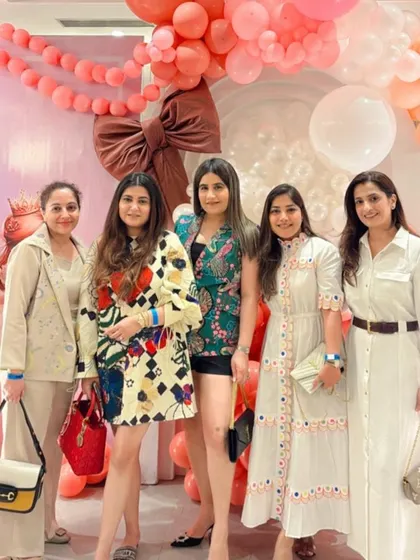 A group of friends and family gathered for a photo, showcasing the festive atmosphere.
