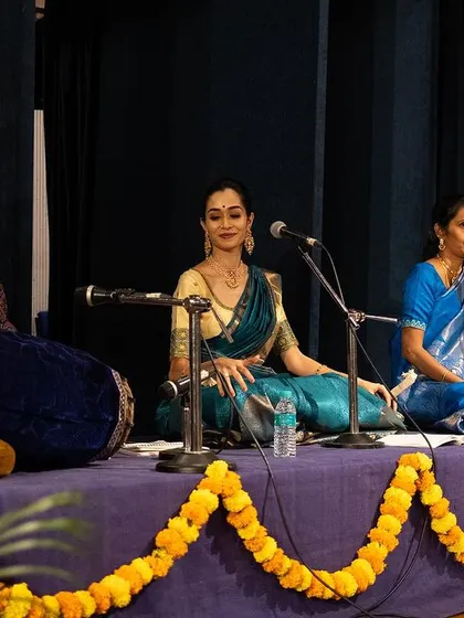 My all-women's music ensemble, the backbone of the Arangetram. Here I am seated with them, performing the Nattuvangam (rhythmic direction) for my student.