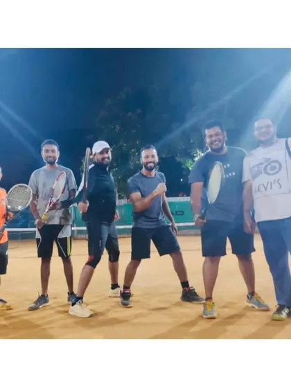 A group of our adult players enjoying a session under the floodlights. The camaraderie extends to our evening and night sessions.