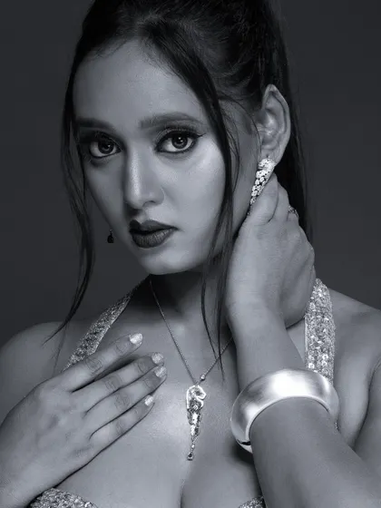 A black and white version of the glamorous portrait, adding a classic, old-Hollywood feel.
