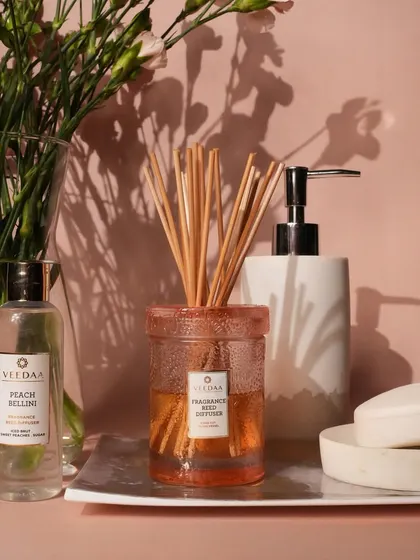 A complete bathroom setup featuring our Peach Bellini reed diffuser. It's a mess-free, low-maintenance way to ensure your space stays fresh and inviting, day after day.