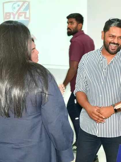 Our director sharing a laugh with players and parents.