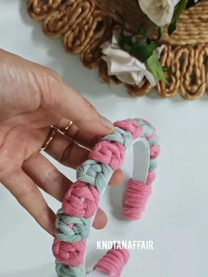 A work-in-progress shot of the macrame rose flower hairband. This design is stylish, trendy, and comfortable, perfect for uplifting any look.