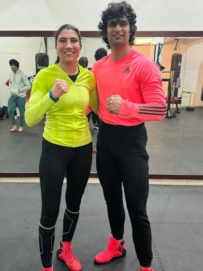 Two of our members posing after a great training session. The energy and camaraderie in our women's classes are a huge part of what makes our community special.