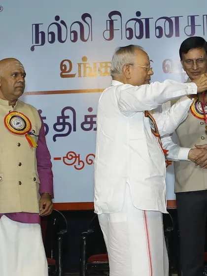 A moment of blessing as I receive the 'ISAI CHUDAR' title from Kartik Fine Arts. These awards are a testament to the blessings of my gurus and the support of my family.