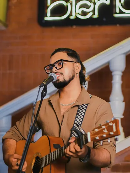A close up from a live solo show. You can see the passion I have for my craft. I am focused on delivering a great vocal performance while connecting with the audience.