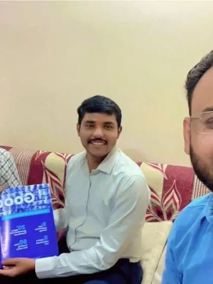 Our team with a customer holding our "GoodZero" brochure.