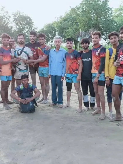 The team posing with a local official after their tournament win.
