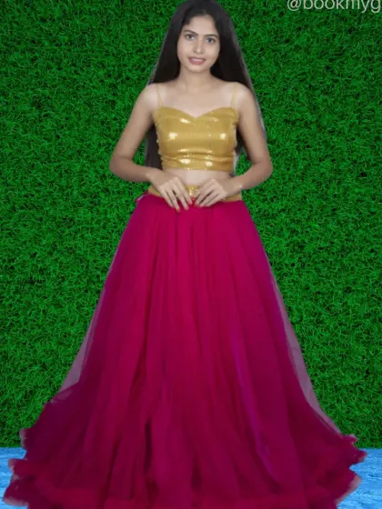 A modern lehenga set featuring a gold sequin top paired with a bright pink tulle skirt. This is a great outfit for sangeet or mehendi functions.