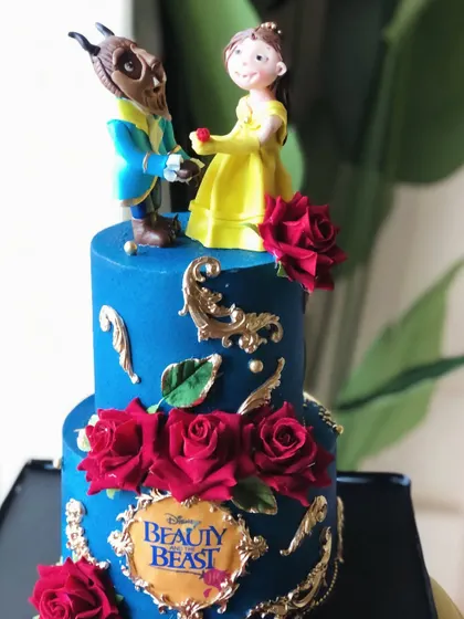 A tale as old as time, sweet as this cake. We bring fairytales to life with this Beauty and the Beast cake, featuring handcrafted figures and deep red sugar roses.