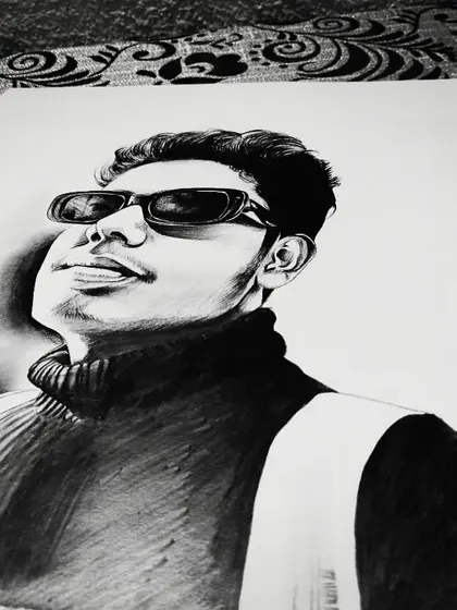 Another angle of my self-portrait. The use of charcoal creates deep blacks, which makes the portrait very striking.