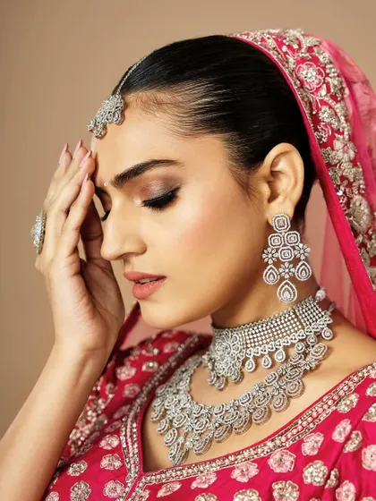 This angle showcases the subtle contouring and the beautifully blended eyeshadow that adds dimension to the face. It's all about creating a look that is perfect from every angle.