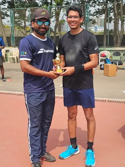 Another key player from our men's team receiving his trophy after the win.