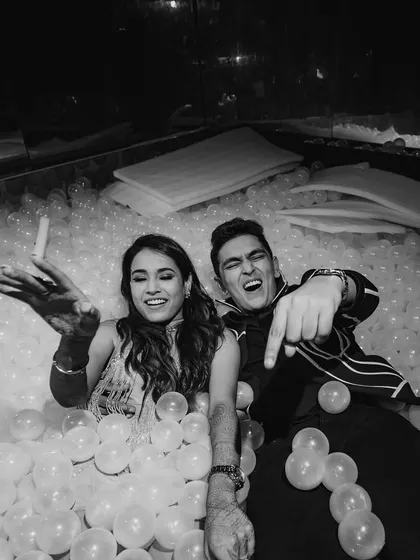 The couple themselves diving into the fun. I believe parties should be playful, and a giant ball pit is the perfect way to let loose and celebrate.
