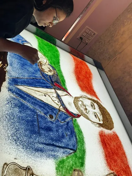 Another angle of the Gukesh Dommaraju tribute, this time with the Indian tricolor in the background, celebrating his achievement as a victory for the entire nation.