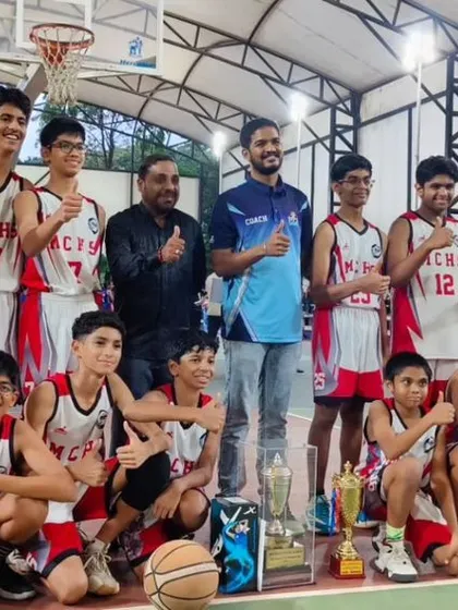 Thumbs up from the champions. The U13 boys team and their coach celebrating a well-deserved state title.