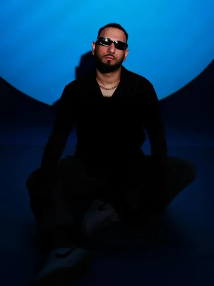 A darker, more shadowed shot from the blue-themed photoshoot, creating a sense of mystery.