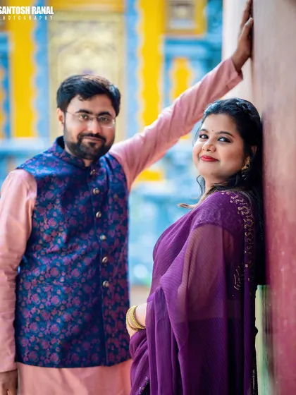 A candid portrait of an expecting couple against a colorful wall. We look for interesting textures and backgrounds to add character and warmth to your maternity photos.