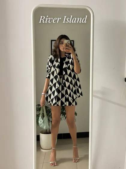 This geometric print blazer and shorts set is another one of my favorites. It's a bold, graphic look that is perfect for making a statement.