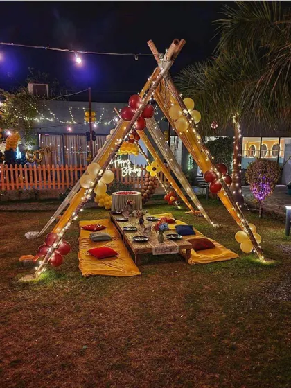My cabana setups are perfect for any open area, like a lawn or garden. This image shows a wider view of the tent structure, which can be customized with balloons and other decor to fit your celebration's theme.